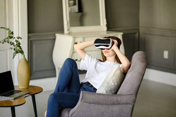 istock young woman uses virtual reality glasses in beautiful flat 1306910986