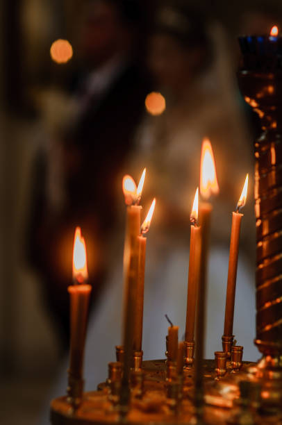 istock stand with candles in the church 1306911901