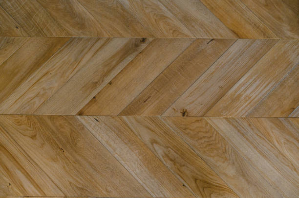 istock Chevron natural parquet seamless floor texture. background 1306912823