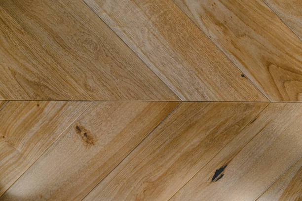 istock Chevron natural parquet seamless floor texture. background 1306913442