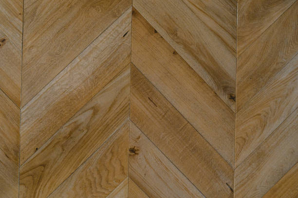 istock Chevron natural parquet seamless floor texture. background 1306913464