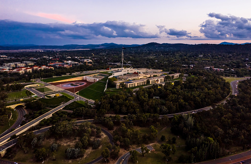 Aerial view of the Australian Parliament House at evening twilight in Canberra, the Australian Capital Territory