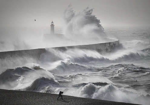 Lighthouse at the rough coastline of Cape Trafalgar, Province of Cádiz, Spain