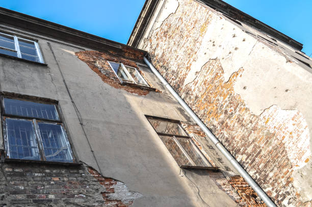 istock windows in old building ruin, damaged brick wall abandoned 1306920950