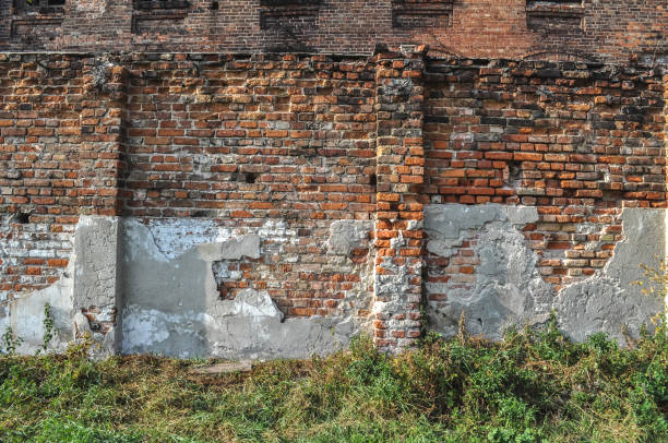 istock old building ruin, damaged brick wall abandoned 1306920970