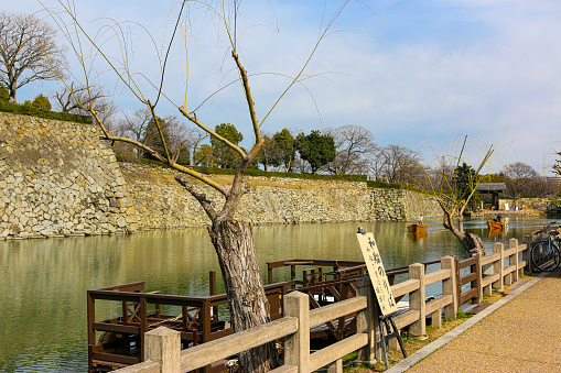 A Japanese boat platform that goes around the moat outside Himeji Castle, a World Heritage Site./ Himeji City, Hyōgo Prefecture, Japan/ 03-13-2020