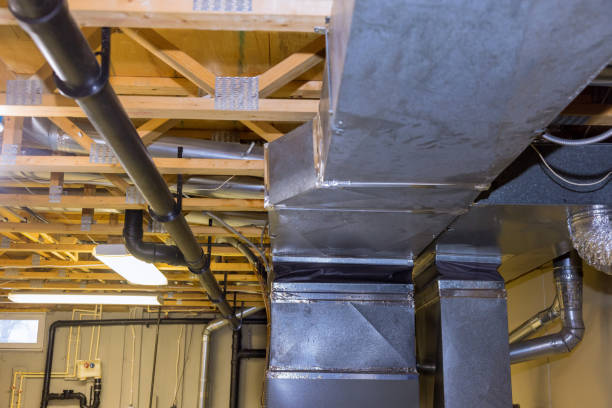 istock Installation of heating system on the ceiling of the pipe heating system 1306931049