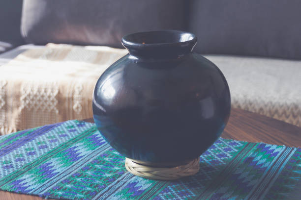 istock Hand made wool textile and clay vase background 1306934969