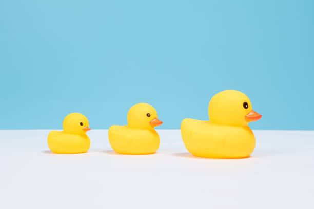 istock Child's toy  duckling,children's day background 1306941143