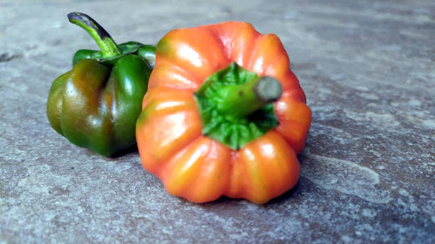 istock fresh colorful pepper isolated on stone background 1306943726
