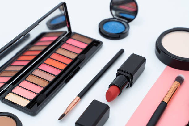 istock set decorative cosmetics on pink and white 1306943936