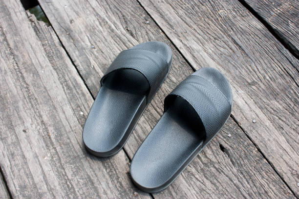 istock Sandal On Wooden Background 1306944771