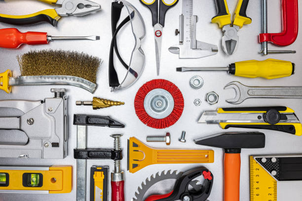 istock house renovation tools and accessories on grey metal background. top view 1306946647