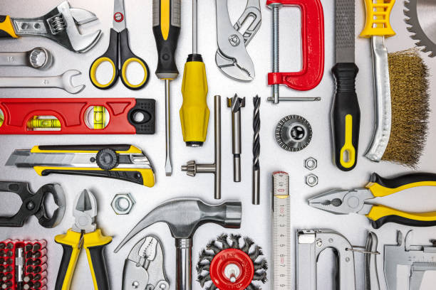 istock different kinds of work tools on grey metal background. view from above 1306946652