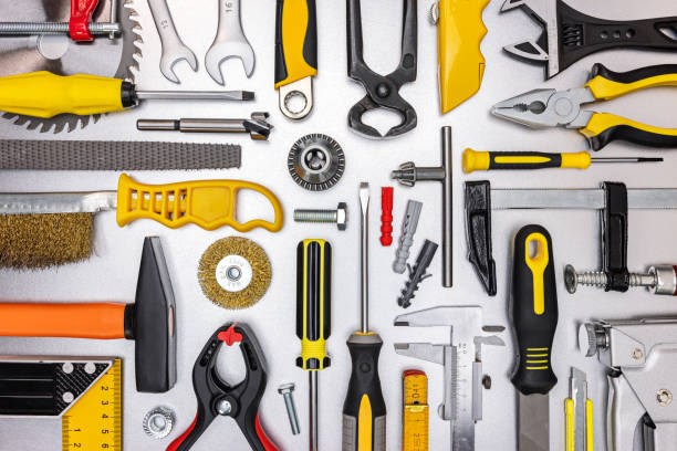 istock set of hand tools on grey background for DIY or home renovation. flat lay 1306947281