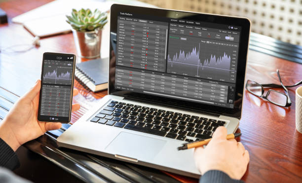 Trade platform, forex trading. Stock exchange market analysis on laptop screen Stock exchange market analysis, Man working with a laptop, monitoring app on screen, office desk background. Trade platform, forex trading. Binary option, candlestick chart. Trading platform stock pictures, royalty-free photos & images