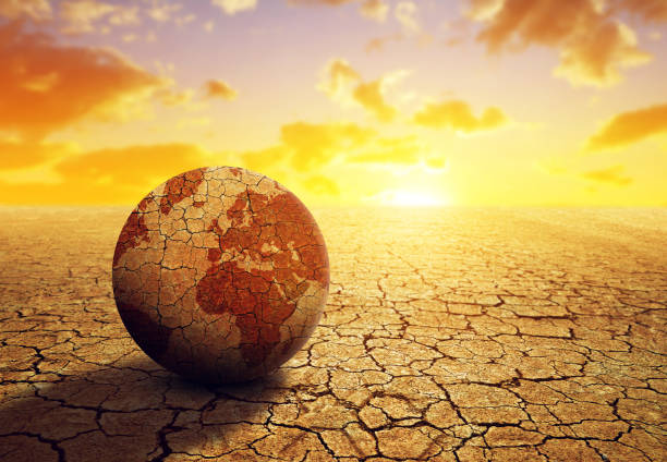 istock Parched planet earth in the dry landscape with cracked soil. 1306959720