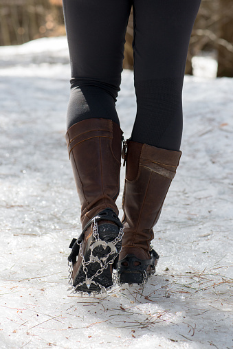 In early spring, roads and trails in rural areas of Canada are often covered by thick ice. Steel traction cleats help to prevent injuries caused by falling.