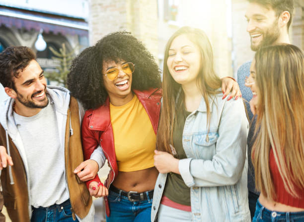 istock Group of young students spending time together after classes - Friends having fun and smiling while walking in the city centre 1306967512