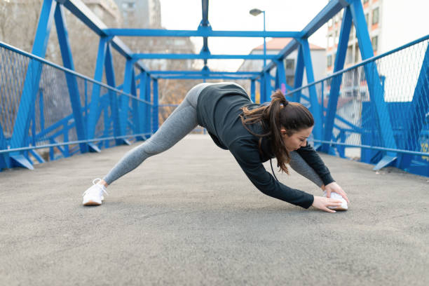 istock Woman stretching before running in the city 1306970581