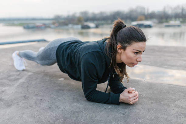 istock Female athlete in plank position outdoors 1306970601