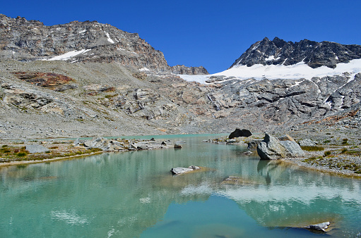 the beautiful lake of the lower sources above the village of Bonneval-sur-Arc in the Vanoise massif in the French Alps