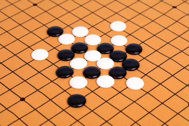 istock chinese game go,  Gobang and go game board 1306973500