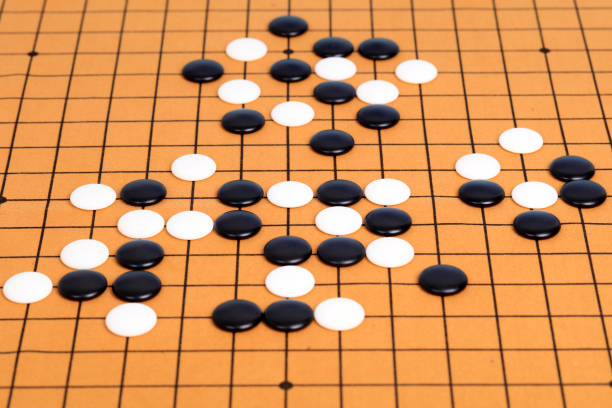 istock chinese game go,  Gobang and go game board 1306973502
