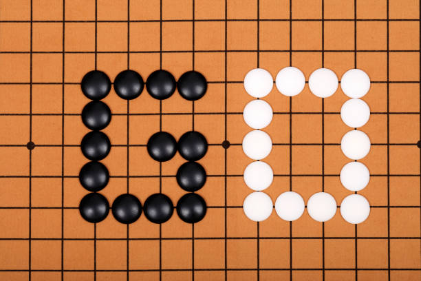istock chinese game go,  Gobang and go game board 1306973515