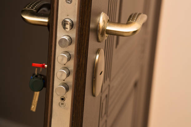 istock Closeup shot of modern door lock with a key. Empty space 1306976563