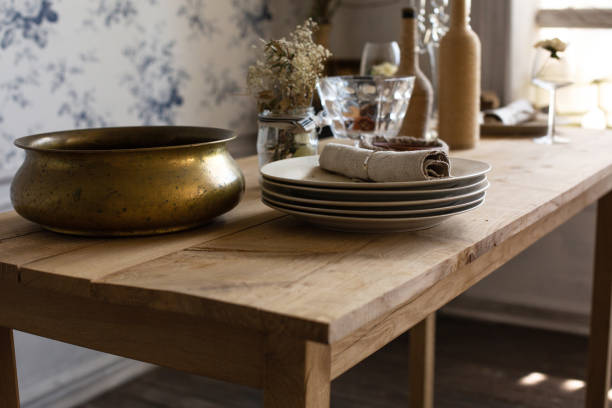 istock Serving on a wooden table with porcelain plates, tissue napkin and copper container 1306976639