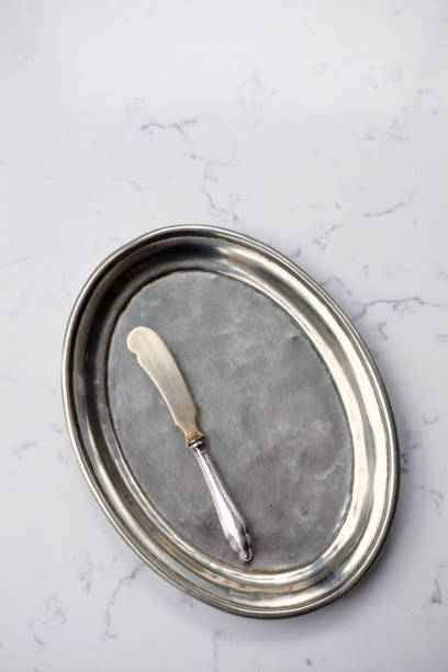 silver knife on silver platter