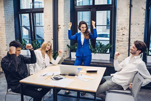 istock successful businesspeople celebrating in office 1306977837