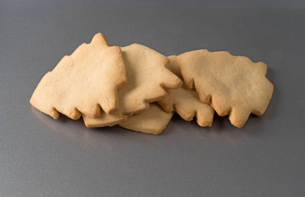 istock Tree shaped Christmas cookies on a baking sheet. 1306977955