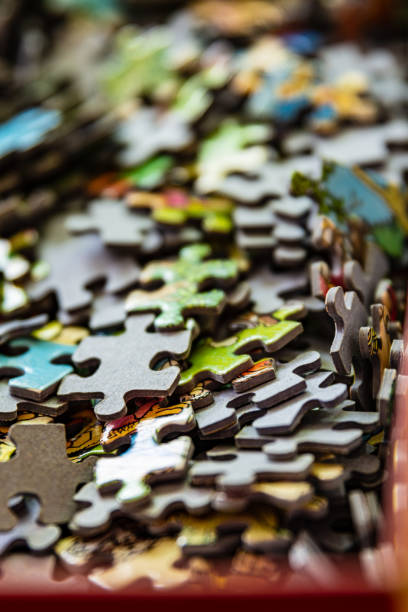 istock A puzzle game in a cardboard box with an open lid 1306986096