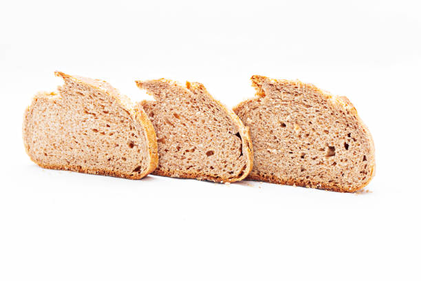 istock piece of bread on white background 1306994262
