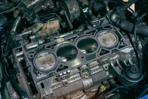 istock Auto mechanic working on car engine in mechanics garage. the cylinder block. 1306995368