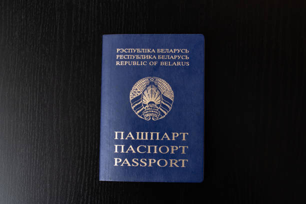 belarusian passport on wooden table close up - belarus imagens e fotografias de stock