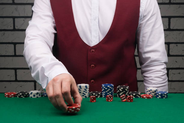 istock the croupier at the green poker table bets with red chips 1306998040