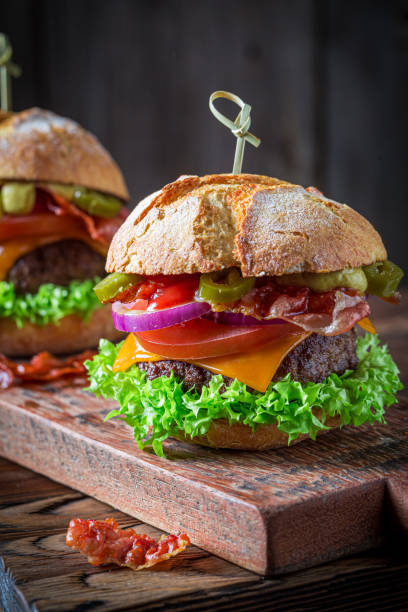 istock Sandwich with beef, cheese and vegetables. American cuisine. 1306999192