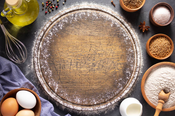istock Bakery ingredients for homemade bread baking on table. Baker set at table background texture. Flat lay top view 1306999205