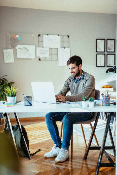 istock Millennial handsome man working after covid-19 reopening 1307001573