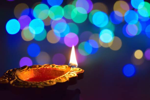 Colorful Diwali Indian traditional lamp Colorful Diwali traditional lamp with blurred background lights diwali photos stock pictures, royalty-free photos & images