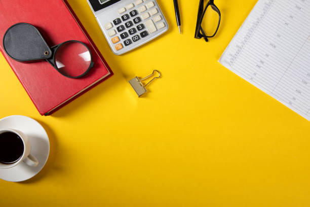 istock magnifier on notebook with finance concept 1307002835