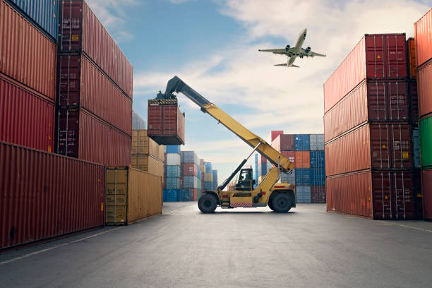 Airplane flying above container port. Airplane flying above container port. shipping stock pictures, royalty-free photos & images