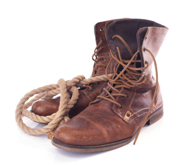 istock old leather vintage boots shoes isolated on white background 1307003856