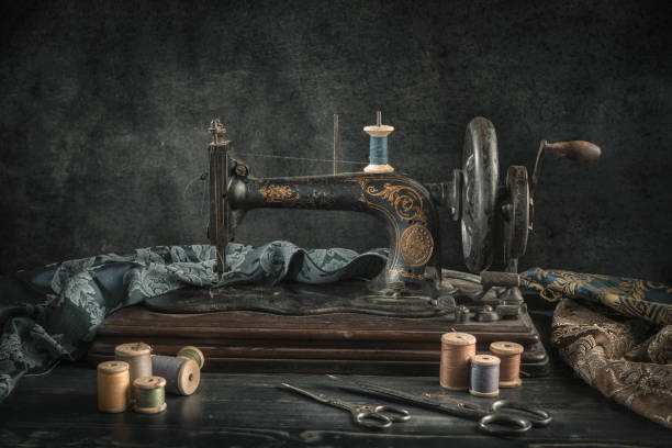 istock The sewing machine and accessories - threads, needle, scissors, measuring tape. 1307005321