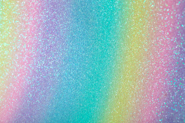 istock Iridescent rainbow background with glitter. Gradient stock texture with fine sparkles 1307007117