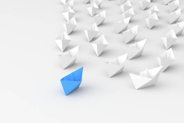 istock Leadership concept, blue leader boat leading white boats, on white background 1307007403