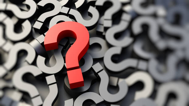 istock Red question mark on a background of black signs, FAQ Concept 1307007424